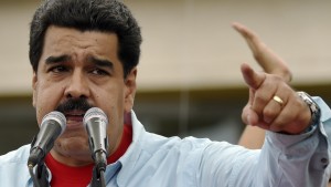 Venezuelan President Nicolas Maduro delivers a speech during a rally in Caracas on August 8, 2015. With Venezuela's economy in recession, oil revenues plunging, crime soaring and consumers facing chronic shortages of basic goods, President Nicolas Maduro's approval rating has sunk in recent months. The rally comes four months from legislative polls the ruling party risks losing for the first time since late leftist leader Hugo Chavez came to power in 1999. AFP  PHOTO/JUAN BARRETO        (Photo credit should read JUAN BARRETO/AFP/Getty Images)